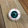 Blutiger Augapfel, Auge mit grüner Iris